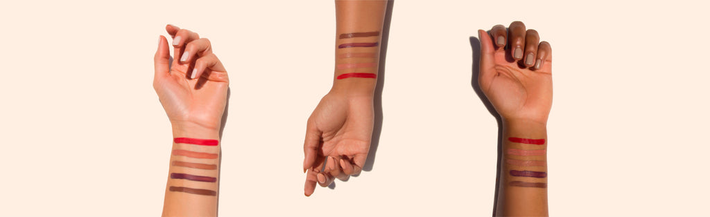 Three women's arms in different skin tones, displaying the range of lip colors available through LipLoveLine